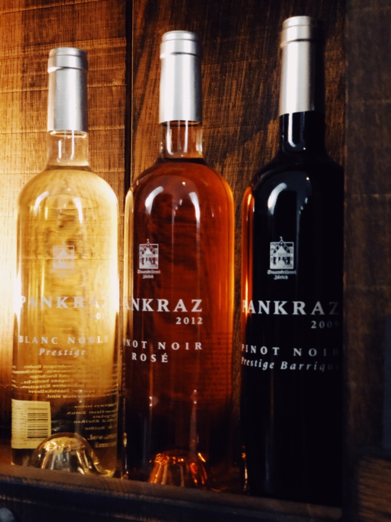 three bottles of different Pankraz wine, white, rose and red