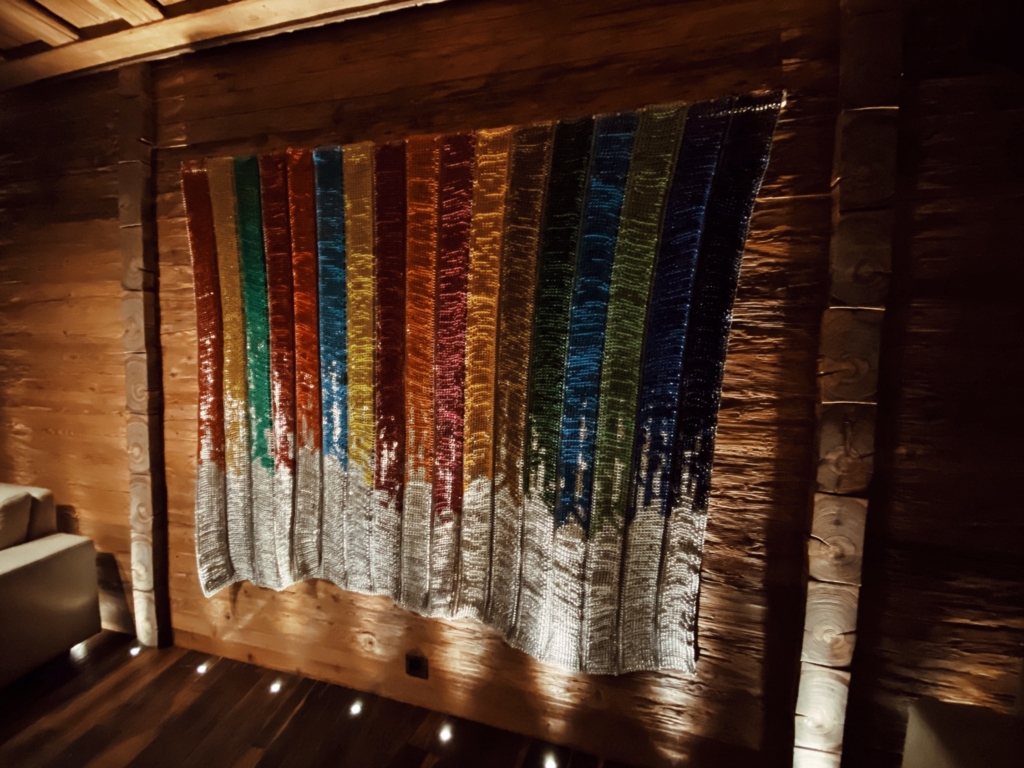 The Alpina Gstaad, the BOTTLETOP project: 600,000 ring pulls collected from landfill and woven together in the colours of the 17 Global Goals using recycled thread