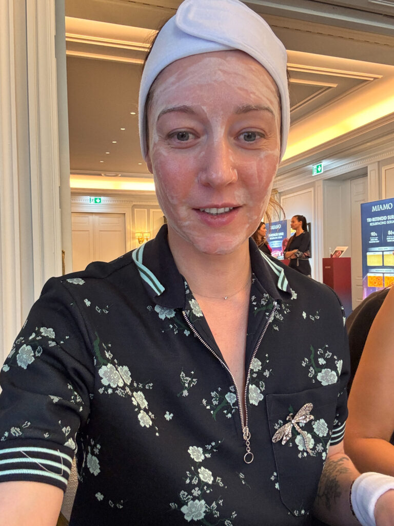 Yuliia Caliskan wearing a white towel headband and a bubbling face masque during the MIAMO masterclass